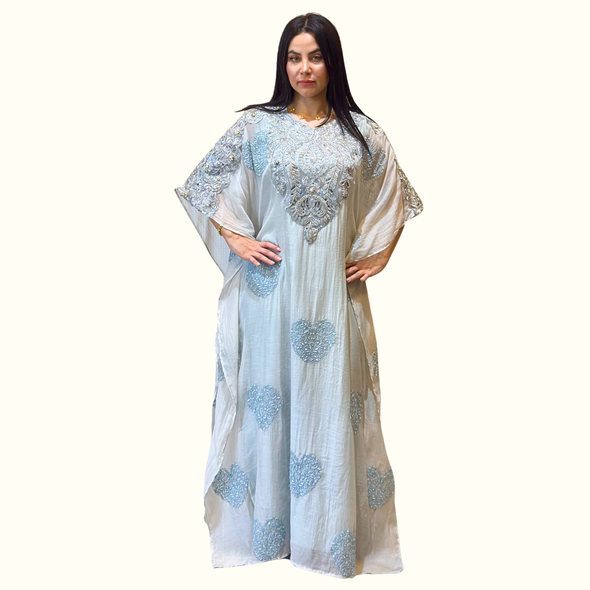 Front view of Rubeena Ameen powder blue 2-piece mul cotton kaftan with heavy silver embroidery and Armani silk slip