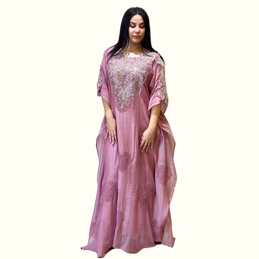 Side view showcasing the airy, light movement of Rubeena Ameen blush orchid mul cotton dress