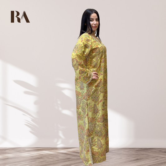 Detailed view of the embroidered long sleeves and fine trim on Rubeena Ameen tissue silk dress
