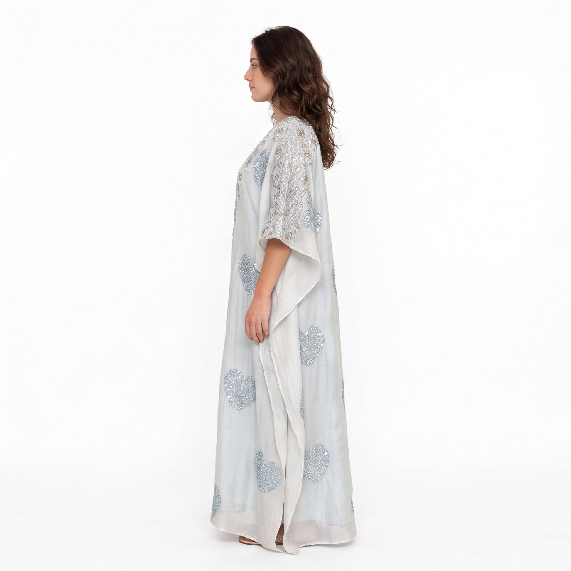 Model wearing a mul cotton two pice kaftan with side angle shown 