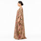 Woman wearing golden embroidered tissue silk kaftan maxi dress, side profile view