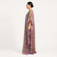Woman wearing lavender floral tissue silk kaftan maxi dress, side profile view