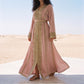 Close-up of the dense gold beaded lace embroidery on the torso of a dusty rose kaftan.