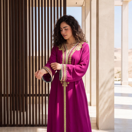 Close-up of the sleeve detailing on a vibrant magenta handmade Moroccan kaftan.