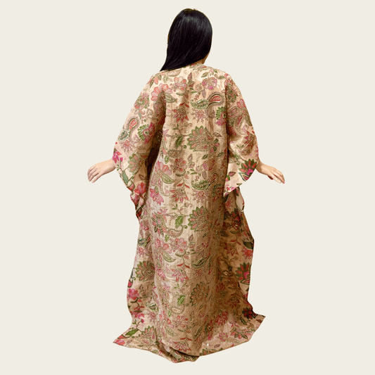 Back view of the ethereal, free-flowing modest silhouette of Rubeena Ameen ivory beige tissue silk kaftan