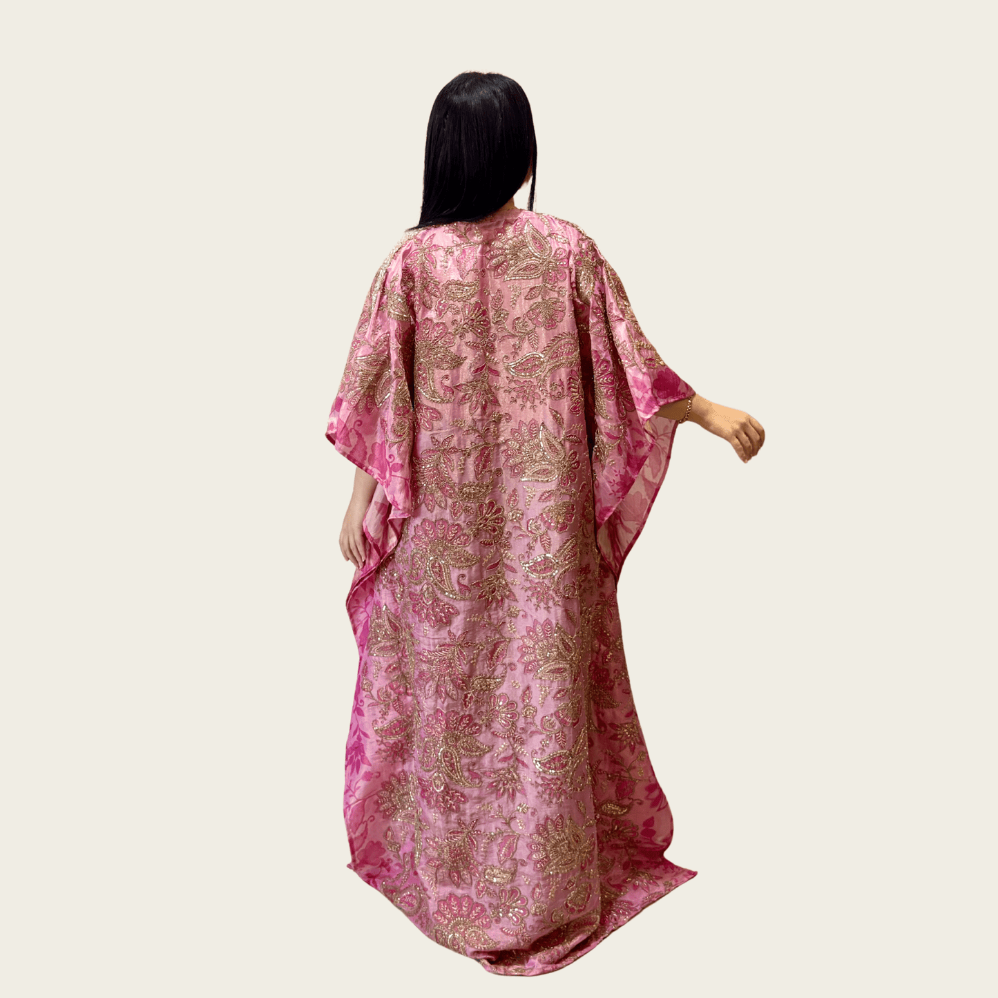 Back view of the floor-skimming, modest drape of Rubeena Ameen premium pink tissue silk dress