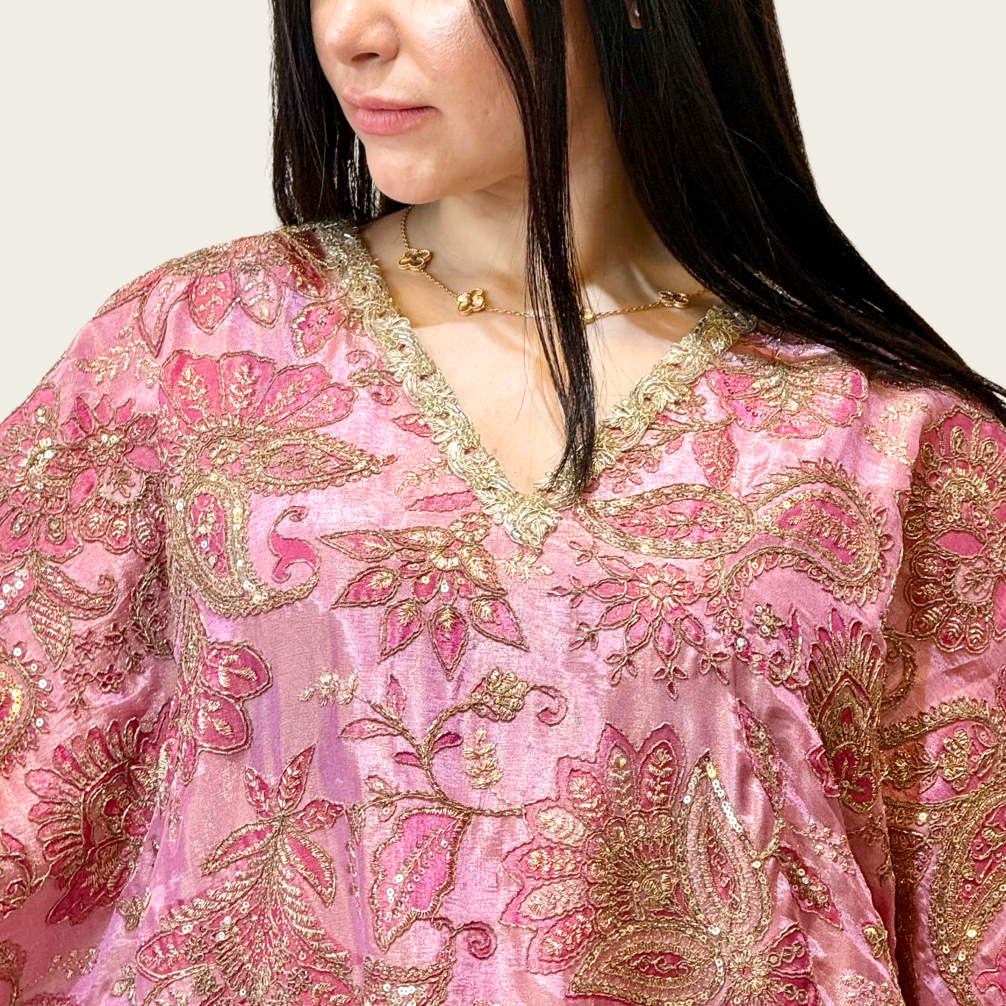 Close-up of the dense, intricate multi-color floral embroidery work on Rubeena Ameen pink luxury kaftan