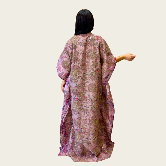 Back view of the relaxed, sweeping loose silhouette of Rubeena Ameen lavender silk kaftan