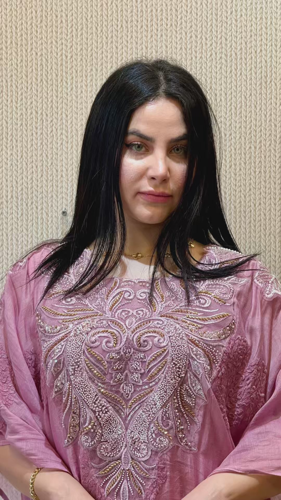 An elegant short reel capturing the breezy movement of the mauve pink 2-piece mul cotton kaftan, highlighting the detailed white embroidery and the fluid, sleeveless Armani silk slip.