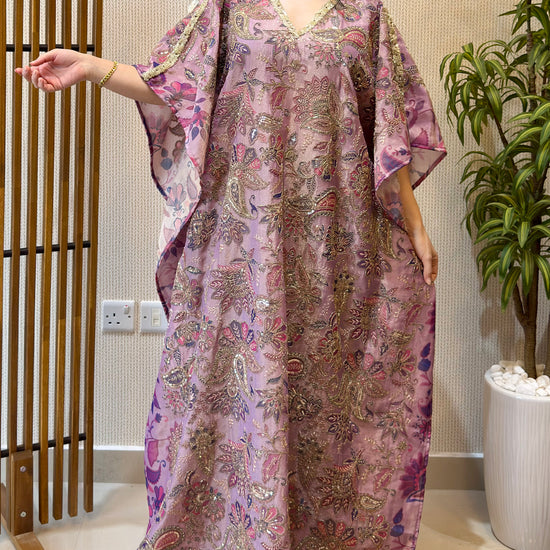 women wearing lavender zari tissue work kaftan and moving beautifully 