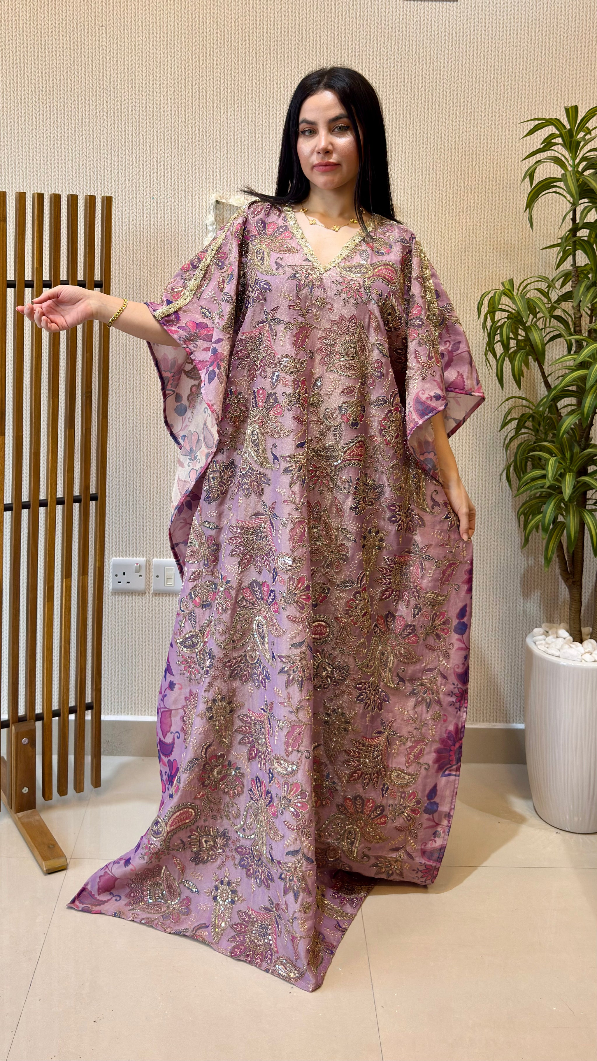 women wearing lavender zari tissue work kaftan and moving beautifully 