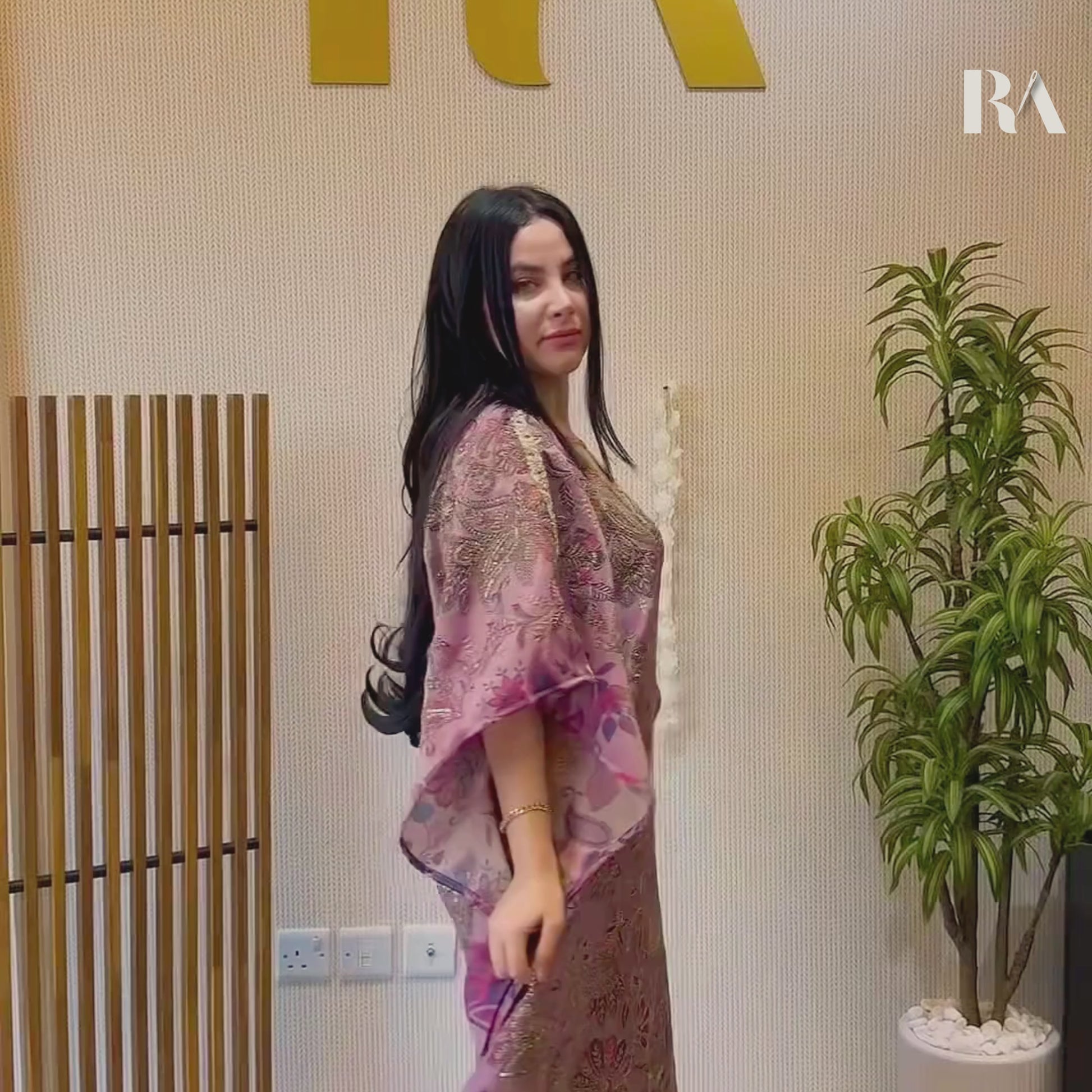 Close-up video of the intricate champagne gold zari embroidery framing the V-neckline of Rubeena Ameen lavender dress