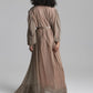 Back View of floor length taupe dress on the grey background