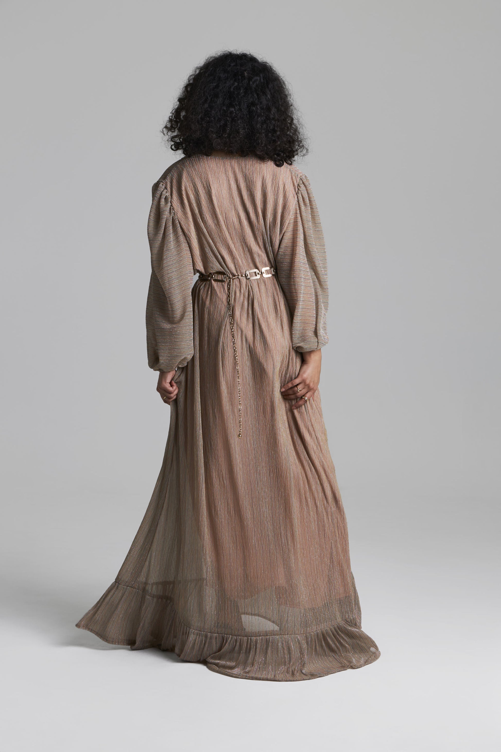 Back View of floor length taupe dress on the grey background