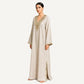 Beige pure linen kaftan with gold mirror embroidery, 3/4 angle view showing neckline detail