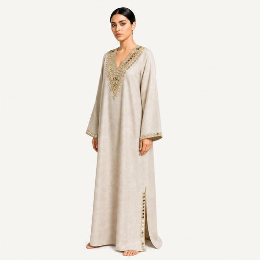 Beige pure linen kaftan with gold mirror embroidery, 3/4 angle view showing neckline detail