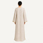 Back view of beige pure linen kaftan with relaxed floor-length silhouette