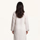Back view of ivory pure linen kaftan with relaxed floor-length silhouette
Description: Back view of the ivory pure linen kaftan, showing the clean back panel and breathable, relaxed fit of the pure linen fabric.